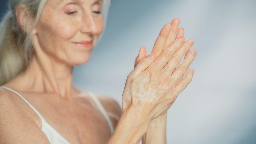 Portrait of Beautiful Senior Woman Using Fragrance-Free Hand Mosturizing Cream.